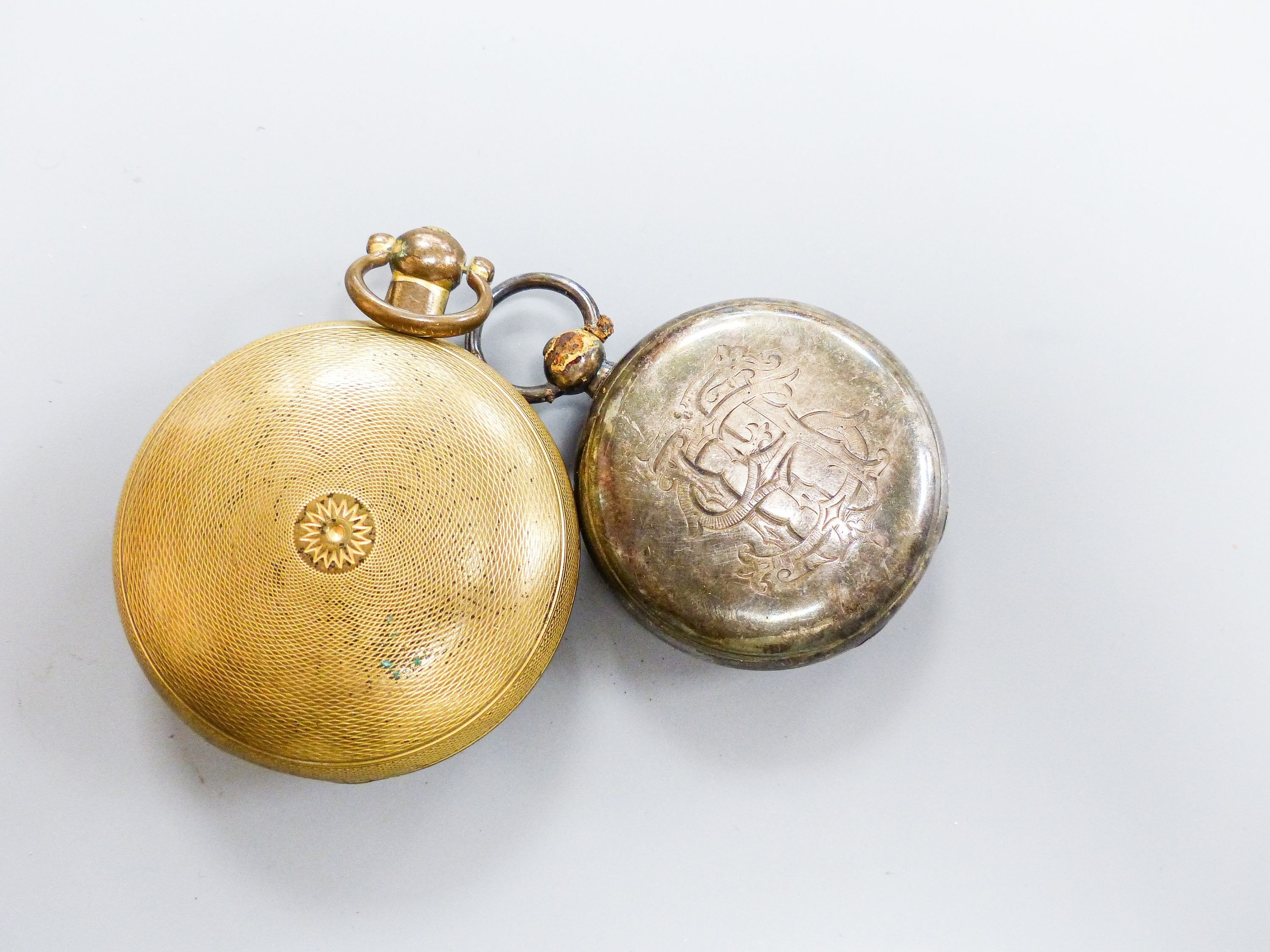 A 19th century engine turned gilt metal hunter verge pocket watch, by Johnson of London, case diameter 52mm, together with a Victorian silver open face pocket watch.